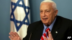 In this file photo taken on Monday, Nov. 21, 2005, Israeli Prime Minister Ariel Sharon speaks during a press conference at his Jerusalem office.