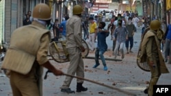 Indian police clash with Kashmiri protesters in Srinagar on July 11, 2016.