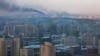 Smoke rises from factories over central Pyongyang, North Korea, Dec. 9, 2011. (AP)