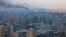 Smoke rises from factories over central Pyongyang, North Korea, Dec. 9, 2011. (AP)