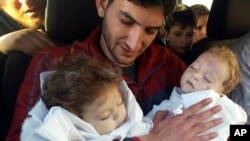 Abdul-Hamid Alyousef, 29, holds his twin babies, who were killed during a suspected chemical weapons attack, in Khan Sheikhoun in the northern province of Idlib, Syria, April 4, 2017. Alyousef also lost his wife, two brothers, nephews and many other family members in the attack that claimed scores of his relatives. 
