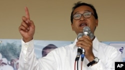 Sam Rainsy, leader of Cambodia's opposition Sam Rainsy Party, speaks during a campaign rally in Kandal province, Cambodia, July 11, 2008