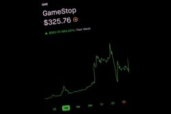 Trading information for GameStop is displayed on the Robinhood App in this photo illustration January 29, 2021. REUTERS/Brendan McDermid/Illustration