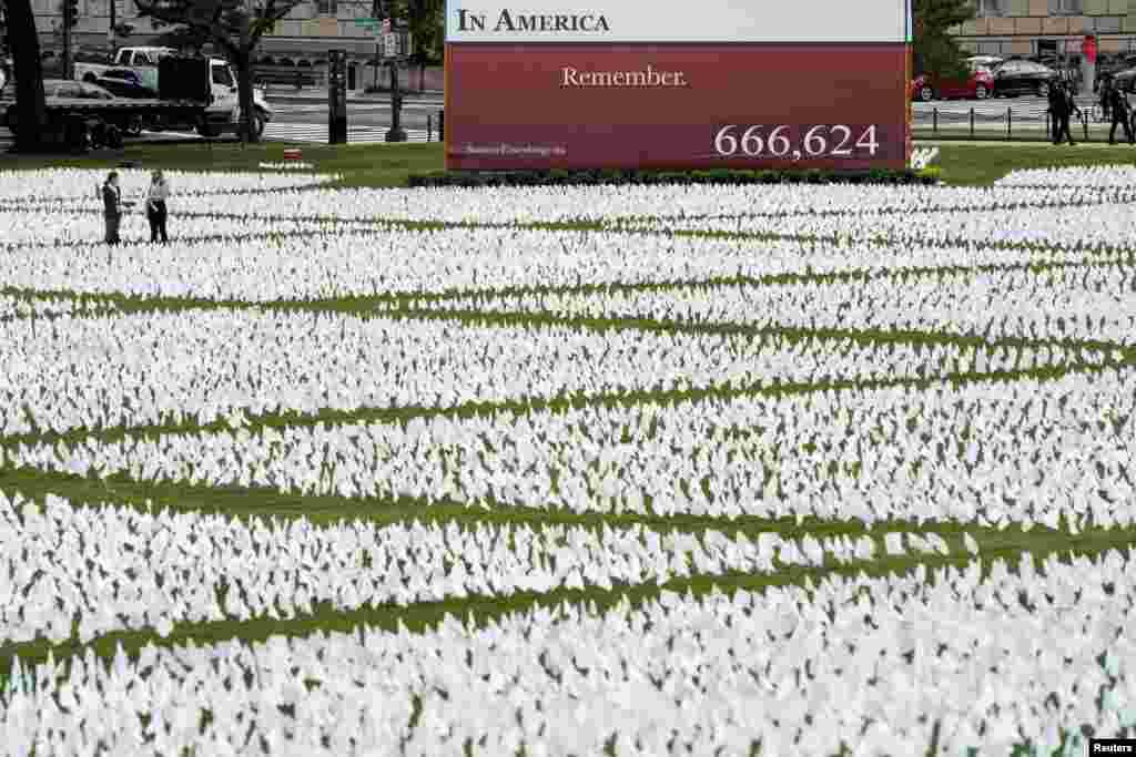 An exhibition of white flags representing Americans who have died of COVID-19, which are placed over 20 acres of the National Mall, is seen in Washington.