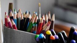 Colored pencils, sharpened and at the ready, rest in a container on the desk of artist Robert Seaman in his room at an assisted living facility Monday, May 10, 2021, in Westmoreland, N.H.