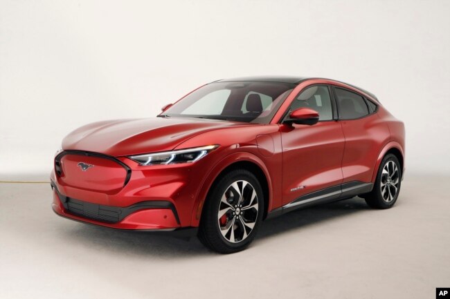 FILE - In this Wednesday, Oct. 30, 2019 photo, the new Ford Mustang Mach-E SUV is shown in Warren, Michigan. Americans will have a tax credit of $4,000 to buy a used electric vehicle and up to $7,500 for a new one. (AP Photo/Carlos Osorio)