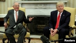 FILE - U.S. President Donald Trump meets with Peru's President Pedro Pablo Kuczynski at the White House in Washington, Feb. 24, 2017. 