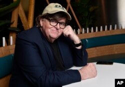 Michael Moore, director of the new documentary film "Fahrenheit 11/9," poses for a portrait at the Endeavor Lounge during the Toronto Film Festival, Sept. 7, 2018, in Toronto.