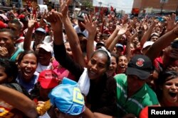 Supporters of Venezuela's President Nicolas Maduro attend a campaign rally in Charallave, Venezuela, May 15, 2018.