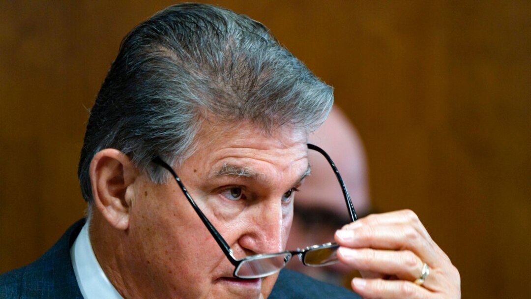 Sen. Joe Manchin, D-W.Va., a key holdout vote on President Joe Biden's domestic agenda, chairs a hearing of the Senate Energy and Natural Resources Committee, at the Capitol in Washington, Oct. 19, 2021.
