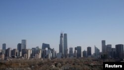 FILE - Buildings are seen against blue sky after the wind dispelled dangerously high levels of air pollution in Beijing, China, December 22, 2016. (REUTERS/Jason Lee/File Photo)