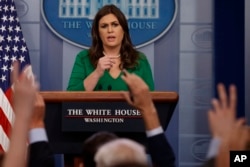 FILE - White House press secretary Sarah Sanders speaks during the daily press briefing, Oct. 27, 2017, in Washington.