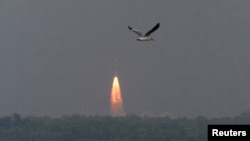 India's Polar Satellite Launch Vehicle (PSLV-C25), carrying the Mars orbiter, lifts off from the Satish Dhawan Space Centre in Sriharikota, about 100 km (62 miles) north of the southern Indian city of Chennai, Nov. 5, 2013.