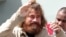 Mexican castaway who identified himself as Jose Ivan and later told that his full name is Jose Salvador Alvarenga walks with the help of a Majuro Hospital nurse in Majuro after a 22-hour boat ride from isolated Ebon Atoll,  Feb. 3, 2014. 