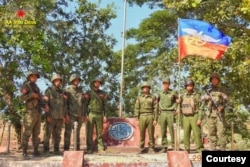 FILE - A photo released by the Arakan Army shows its members posing at one of the Myanmar junta's military outposts, captured in Gwa Township, southern Rakhine State, Myanmar, on Dec. 29, 2024.