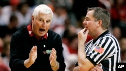 FILE - Texas Tech coach Bob Knight, left, argues a call with an NCAA official during a basketball game against Texas A&M in Lubbock, Texas, Jan. 16, 2008. Knight, the brilliant and combustible coach who years was the scowling face of college basketball has died. He was 83. 