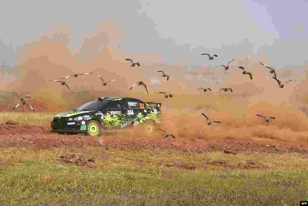 British driver Nikhil Sachania steers his Mitsubishi Lancer Evo X with Kenyan co-driver Deep Patel ahead of the 2021 Safari Rally Kenya during a side-by-side super special at Kasarani near Nairobi, Kenya.