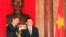 中国国务委员杨洁篪与越南国家主席张晋创合影(资料照片)