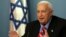 In this file photo taken on Monday, Nov. 21, 2005, Israeli Prime Minister Ariel Sharon speaks during a press conference at his Jerusalem office.