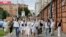 About 200 women march in solidarity with protesters injured in the latest rallies against the results of the country's presidential election in Minsk, Belarus, Aug. 12, 2020.
