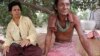 Cambodian legs amputee Meo, right, 48, sits next to his wife at their home in Prey Tapork village, Kandal province, about 30 kilometers (18 miles) west of Phnom Penh, Cambodia, Sunday, March 29, 2009. Meo was amputee in 1994 in a strong hold while he was a soldier fighting with Khmer Rouge. On Monday, March 30, 2009, Kaing Guek Eav, also known as "Duch" will go on trial for crimes against humanity. "Duch" was commander of the Toul Sleng prison under the Khmer Rouge where thousands were tortured and killed. (AP Photo/Heng Sinith)