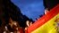 Anti-independence demonstrators waving Spanish flags shout slogans during a protest in Barcelona, Oct. 4, 2017.