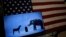 The mascots of the Democratic and Republican parties, a donkey for the Democrats and an elephant for the GOP, are seen on a video screen at Democratic U.S. presidential candidate Hillary Clinton's campaign rally in Cleveland, Ohio, March 8, 2016. 