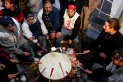 Members of the Mashpee Wampanoag tribe drum while waiting for news that the tribe has won recognition as a sovereign nation, Feb 15, 2007, in Mashpee, Mass. On March 29, 2020, the Interior Department said he would disestablish the tribe.