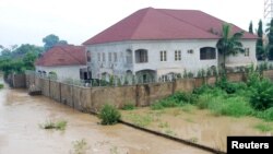 Newly-built houses on the bank of the River Kaduna are seen in flood waters after hours of rainfall in Kaduna, Nigeria, Aug. 15, 2015.