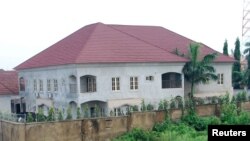 Newly-built houses on the bank of the River Kaduna are seen in flood waters after hours of rainfall in Kaduna, Nigeria August 15, 2015.