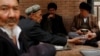 FILE PHOTO - Uighur men drink tea in the old town in Kashgar, Xinjiang Uighur Autonomous Region, China, March 22, 2017. REUTERS/Thomas