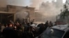 Security officers and rescuers gather at a building destroyed in an Israeli airstrike in Damascus, Syria, on Nov. 14, 2024.