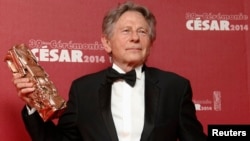 FILE - Director Roman Polanski poses with his Best Director award for "La Venus A La Fourrure" ("Venus in Fur") at the 39th Cesar Awards ceremony in Paris, Feb. 28, 2014.