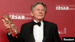 FILE - Roman Polanski poses with his Best Director award for "La Venus A La Fourrure" ("Venus in Fur") at the 39th Cesar Awards ceremony in Paris, Feb. 28, 2014.