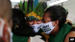 Relatives cry during the funeral of Kokama Chief Messias Martins Moreira, who died of COVID-19, during his burial service at the Park of Indigenous Nations in Manaus, Brazil, May 14, 2020.