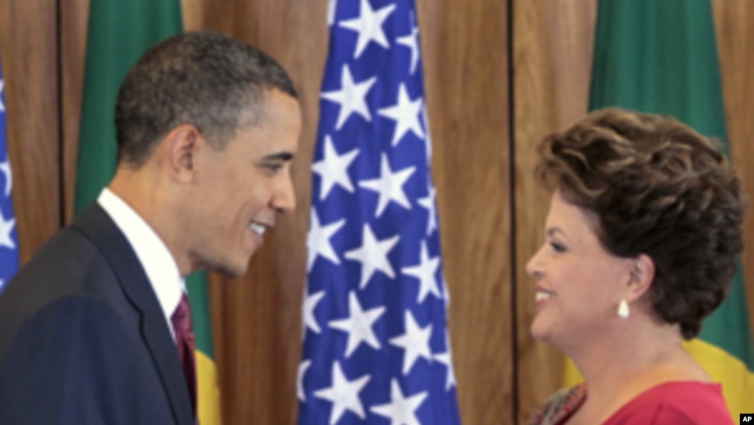 US President Barack Obama, left, shakes hands with Brazilian President Dilma Vana Rousseff, right, following their joint news conference at the Palacio do Planalto in Brasilia, Brazil, Saturday, March 19, 2011. "