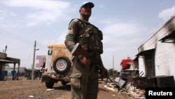 A United Nations peacekeeper on patrol in the town of Malakal, Upper Nile State.