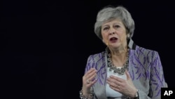 Former British Prime Minister Theresa May speaks at the Global Women's Forum in Dubai, United Arab Emirates, Feb. 17, 2020. 