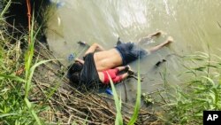 The bodies of Salvadoran migrant Oscar Alberto Martínez Ramírez and his nearly 2-year-old daughter Valeria lie on the bank of the Rio Grande in Matamoros, Mexico, June 24, 2019, after they drowned trying to cross the river to Brownsville, Texas.