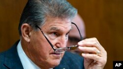 Sen. Joe Manchin, D-W.Va., a key holdout vote on President Joe Biden's domestic agenda, chairs a hearing of the Senate Energy and Natural Resources Committee, at the Capitol in Washington, Oct. 19, 2021.