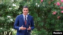 FILE PHOTO: Spain's Prime Minister Pedro Sanchez speaks during a brief news conference after his traditional summer meeting with King Felipe at Marivent Palace in Palma de Mallorca, Aug. 7, 2019.