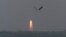 India's Polar Satellite Launch Vehicle (PSLV-C25), carrying the Mars orbiter, lifts off from the Satish Dhawan Space Centre in Sriharikota, about 100 km (62 miles) north of the southern Indian city of Chennai, Nov. 5, 2013.