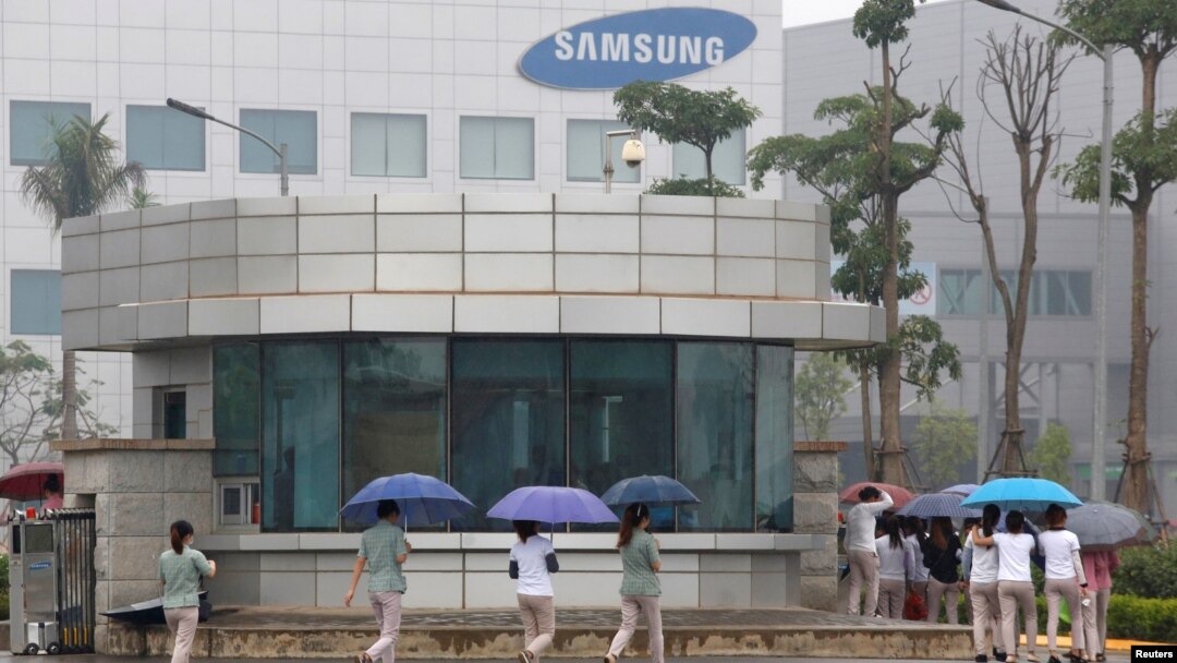 FILE - Employees make their way to work at the Samsung factory in Thai Nguyen province, north of Hanoi, Vietnam, Oct. 13, 2016. 