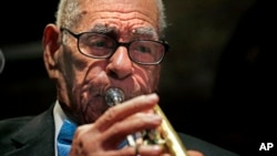 Dixieland jazz musician Lionel Ferbos performs at his 102nd birthday party at the Palm Court Jazz Cafe in New Orleans, July 17, 2013.
