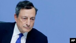 President of European Central Bank, Mario Draghi, listens during a news conference in Frankfurt, Germany, Dec. 8, 2016, following a meeting of the ECB governing council. 