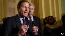 Sen. Richard Blumenthal, D-Conn., accompanied by Sen. Sheldon Whitehouse, D-R.I., speaks to reporters during a news conference on Capitol Hill in Washington, Feb. 7, 2017. 