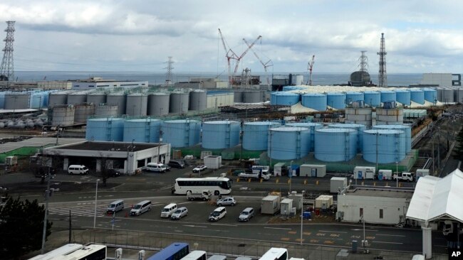 FILE - This photo shows some of about 1,000 huge tanks holding treated but still radioactive wastewater at the Fukushima Daiichi nuclear power plant in Okuma town, northeastern Japan, on Feb. 22, 2023.
