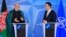 Afghanistan's President Hamid Karzai (L) and NATO Secretary General Anders Fogh Rasmussen make a joint statement before a meeting at NATO headquarters in Brussels, April 23, 2013.