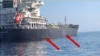 Image released by the U.S. military's Central Command, shows damage and a suspected mine on the Kokuka Courageous in the Gulf of Oman near the coast of Iran, June 13, 2019. (US Central Command)