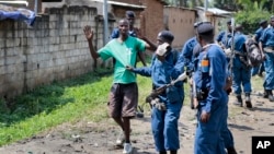 Burundian police arrest a demonstrator during clashes with security forces in the Cibitoke district of the capital Bujumbura, Burundi, May 29, 2015. 